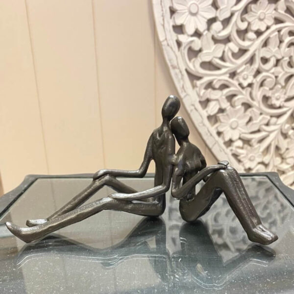 back to back couple sculpture